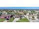 Aerial view of neighborhood with houses and palm trees at 6297 Lori Ter, Port Charlotte, FL 33981