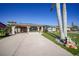 Attractive single-story home with a welcoming front yard and palm trees at 6297 Lori Ter, Port Charlotte, FL 33981