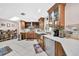 Modern kitchen with stainless steel appliances and wood cabinets at 12325 Mitchell Ter, Port Charlotte, FL 33981