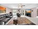 Relaxing living room featuring leather furniture and large TV at 12325 Mitchell Ter, Port Charlotte, FL 33981