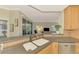 Kitchen island with double sink and granite countertops at 3113 Club Dr # 118, Port Charlotte, FL 33953