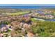 Wide shot of waterfront homes and lush golf course at 3113 Club Dr # 118, Port Charlotte, FL 33953