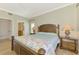 Main bedroom with king-size bed and ensuite bathroom at 3113 Club Dr # 118, Port Charlotte, FL 33953