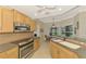 Spacious kitchen with stainless steel appliances and breakfast nook at 3113 Club Dr # 118, Port Charlotte, FL 33953