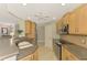 Open concept kitchen with island and stainless steel appliances at 3113 Club Dr # 118, Port Charlotte, FL 33953
