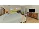 Main bedroom with king-size bed and access to patio at 3113 Club Dr # 118, Port Charlotte, FL 33953
