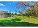 Landscaped backyard with pond and lush greenery at 3113 Club Dr # 118, Port Charlotte, FL 33953