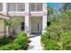 Condo entrance with walkway and manicured landscaping at 3113 Club Dr # 118, Port Charlotte, FL 33953