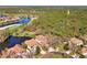 Aerial perspective of homes situated near a golf course and water at 3113 Club Dr # 118, Port Charlotte, FL 33953