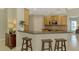 Modern kitchen with light wood cabinets and stainless steel appliances at 3113 Club Dr # 118, Port Charlotte, FL 33953