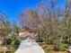 Two-story house with double garage and mature landscaping at 3113 Club Dr # 118, Port Charlotte, FL 33953
