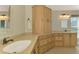 Elegant bathroom with double vanity, large mirror, and ample storage at 3113 Club Dr # 118, Port Charlotte, FL 33953