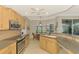 Spacious kitchen with center island, stainless steel appliances and view to backyard at 3113 Club Dr # 118, Port Charlotte, FL 33953