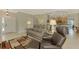 Spacious living room with comfortable seating and view into kitchen at 3113 Club Dr # 118, Port Charlotte, FL 33953