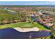 Aerial view showcasing home's location in a golf course community at 3113 Club Dr # 118, Port Charlotte, FL 33953