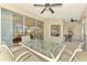 Spacious sunroom with glass walls, seating area, and views of backyard at 3113 Club Dr # 118, Port Charlotte, FL 33953