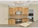Modern kitchen with stainless steel appliances and breakfast bar at 3113 Club Dr # 118, Port Charlotte, FL 33953