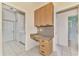 Laundry room with built-in cabinets and countertop at 3487 Pennyroyal Rd., Port Charlotte, FL 33953