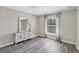 Charming bedroom with hardwood floors and a window with curtains at 10083 Kansas City St, Port Charlotte, FL 33981