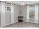 Well-lit bedroom with neutral walls and wood-look flooring at 10083 Kansas City St, Port Charlotte, FL 33981
