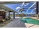 Screened pool and patio area with canal views at 10083 Kansas City St, Port Charlotte, FL 33981