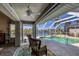 Covered patio overlooking the pool and canal at 10083 Kansas City St, Port Charlotte, FL 33981