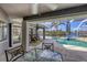 Covered patio with pool access and outdoor seating at 10083 Kansas City St, Port Charlotte, FL 33981