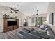 Spacious living room with vaulted ceilings, hardwood floors, and a large sectional sofa at 10083 Kansas City St, Port Charlotte, FL 33981