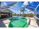 Inviting screened pool with ample deck space at 10083 Kansas City St, Port Charlotte, FL 33981