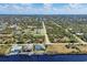 Community overview, showcasing canal and homes at 10083 Kansas City St, Port Charlotte, FL 33981