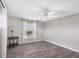 Simple bedroom with hardwood floors and a large window at 10083 Kansas City St, Port Charlotte, FL 33981