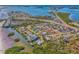 An aerial perspective of the neighborhood with various homes and waterfront views at 105 Crestview Dr, Englewood, FL 34223