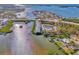 Bird's-eye view of the community, highlighting the pool, waterfront location, and nearby bridge at 105 Crestview Dr, Englewood, FL 34223