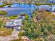 Top-down view of a home with a pool, showcasing the property and surrounding foliage at 105 Crestview Dr, Englewood, FL 34223