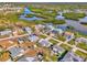 Aerial view of a residential neighborhood with waterfront homes and canals at 105 Crestview Dr, Englewood, FL 34223