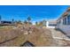 Backyard with dry grass, landscaping, and a shed in the background at 105 Crestview Dr, Englewood, FL 34223