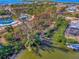 Dock and boat lift on a canal surrounded by trees at 105 Crestview Dr, Englewood, FL 34223