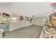 A garage interior with storage shelves and various items at 105 Crestview Dr, Englewood, FL 34223