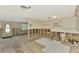 Kitchen mid-renovation, showing exposed framing, tile floor, and entryway at 105 Crestview Dr, Englewood, FL 34223