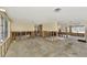 Open concept living room under renovation showing exposed framing and concrete floor at 105 Crestview Dr, Englewood, FL 34223