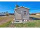 Exterior shot of the storage shed with decorative elements at 105 Crestview Dr, Englewood, FL 34223