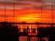 Fiery sunset over marina with boats at 1305 Holiday Dr, Englewood, FL 34223