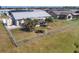 Aerial view of home with fenced backyard, patio, and shed at 13545 Overton Ave, Port Charlotte, FL 33981