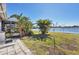 Backyard with lake view and patio at 13545 Overton Ave, Port Charlotte, FL 33981