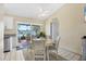 Kitchen dining area with water view and light-colored furnishings at 13545 Overton Ave, Port Charlotte, FL 33981