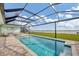 Relaxing pool area with covered lanai and stunning water views at 14 Yellowhammer Dr, Placida, FL 33946