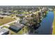 Aerial view showcasing a canal-side home with neighborhood context at 217 Rotonda Cir, Rotonda West, FL 33947