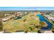 Aerial showing golf course and homes with water access at 217 Rotonda Cir, Rotonda West, FL 33947