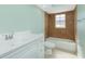 Clean bathroom, featuring a white vanity and tiled shower/tub at 217 Rotonda Cir, Rotonda West, FL 33947