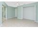 Bedroom with sliding glass doors and a large closet at 217 Rotonda Cir, Rotonda West, FL 33947